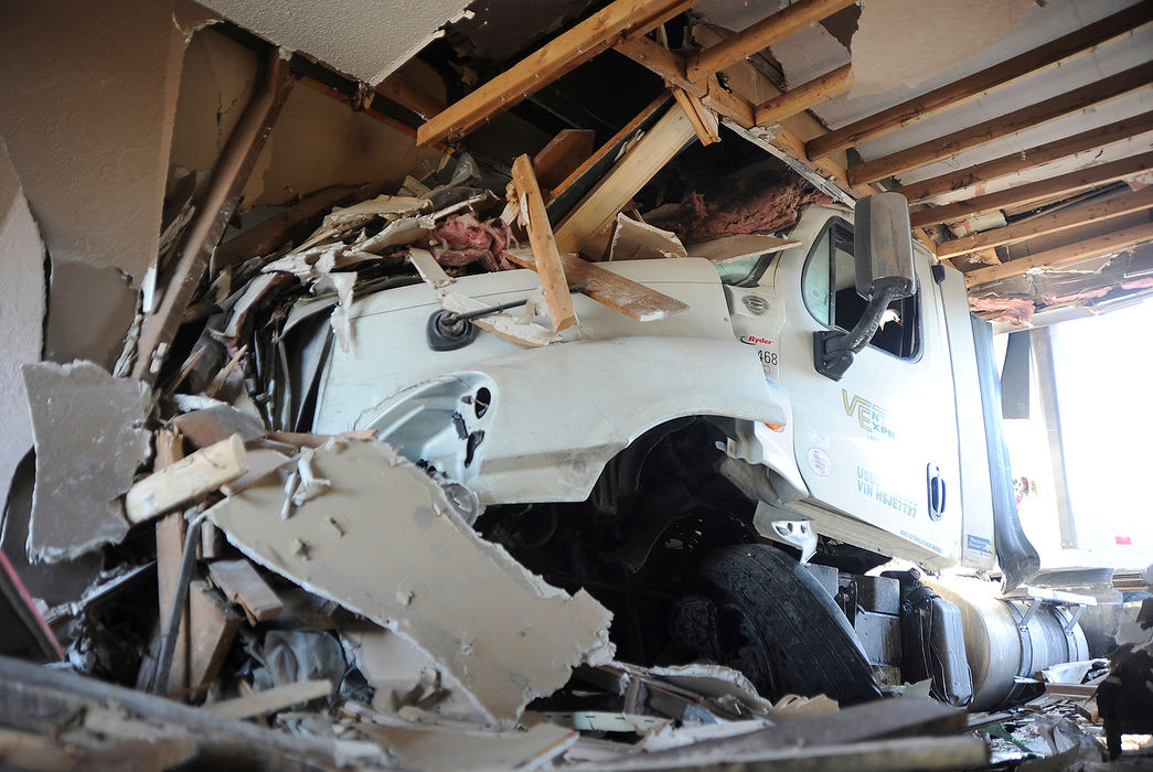 Spot News - 3rd placeA mother and her two children were unharmed when a semitrailer crashed into their house on U.S. 127 near Mendon.(Daniel Melograna / The Daily Standard)